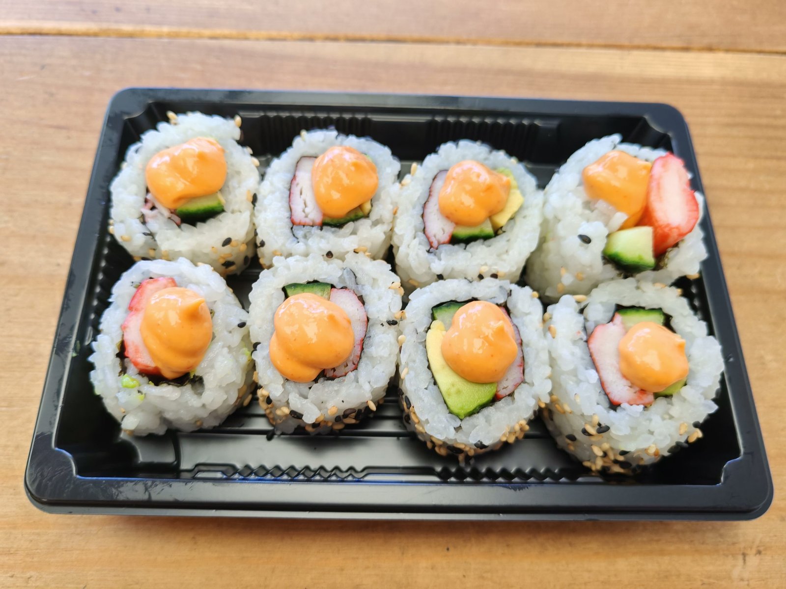 Crab Stick, Cucumber, Avocado and Spicy Sesame Seeds Topped With Spicy Mayo
