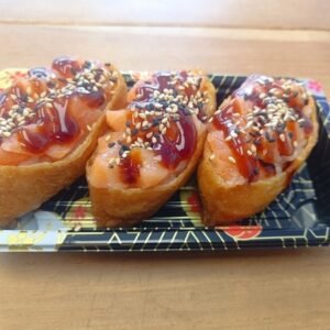 Chopped Salmon Inari - 3 Pieces Rice Inside Fried Sweet Tofu Pouch Topped With Chopped Salmon Homemade Teriyaki Sauce Sesame Seeds