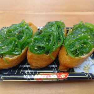 Rice Inside Fried Sweet Tofu Pouch Topped With Goma Wakame (Seasoned Seaweed)