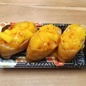 Mango Inari - 3 Pieces Rice Inside Fried Sweet Tofu Pouch Topped With Mango & Sweet Chilli Sauce.
